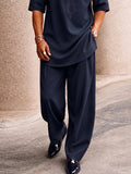 Completo casual con borsa creativa, top longline e pantaloni