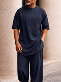 Completo casual con borsa creativa, top longline e pantaloni